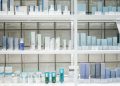 A clean and organized display of skincare products on shelves, perfect for beauty enthusiasts.