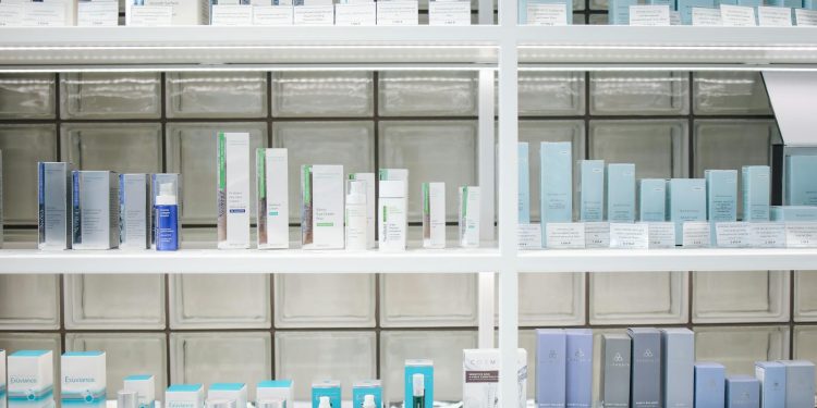 A clean and organized display of skincare products on shelves, perfect for beauty enthusiasts.