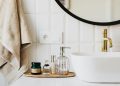 A stylish bathroom sink with skincare products and accessories for modern living.
