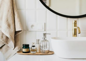 A stylish bathroom sink with skincare products and accessories for modern living.
