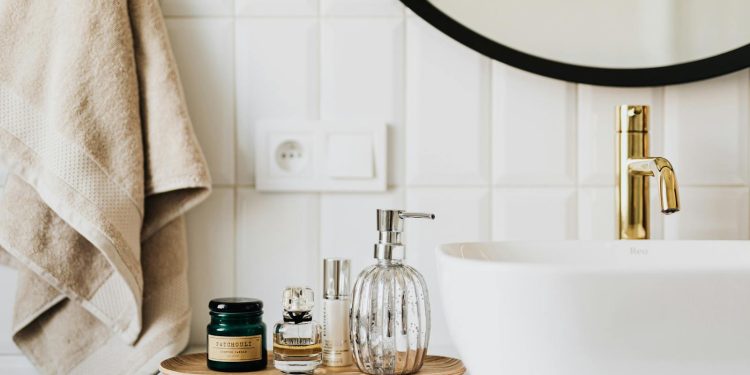 A stylish bathroom sink with skincare products and accessories for modern living.