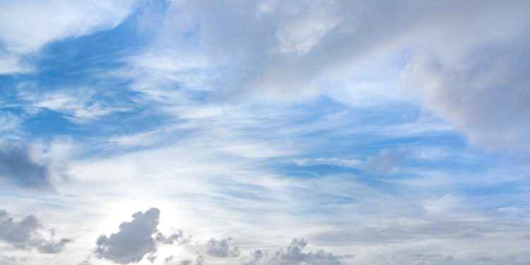 Tranquil blue and white cloudscape above Kapaa with light soft clouds.