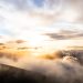 clouds above mountains during golden hour
