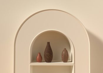 a white shelf with objects on it