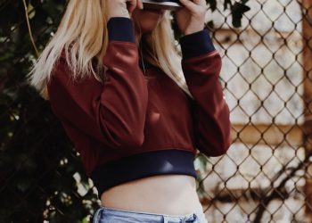 women holding camera taking a picture